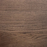 Close-up of dark stained solid oak in tobacco brown, showing the grain through the matte lacquer