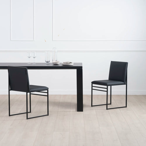 Diana dining table in black with black oak, accompanied by sleek black chairs—ideal for modern dining spaces.