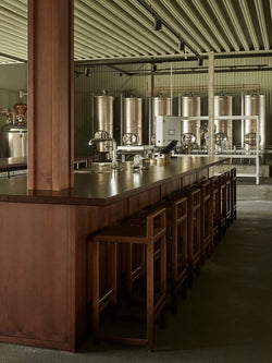 Norrbottens Destilleri’s bar area furnished with Ebba bar stools from by Crea.