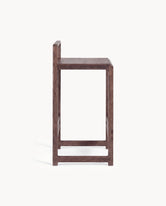 Side view of Oak Bar Stool Ebba with a dark oak frame showcasing its modern design.