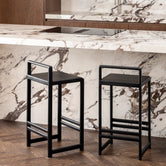 Oak Bar Stool Ebba in black oak frame, enhancing a modern kitchen or bar with style and comfort.