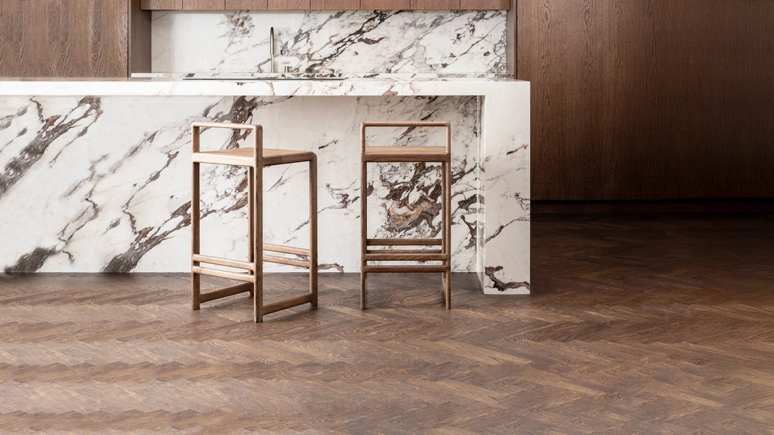 Ebba bar stools in dark oak at a marble kitchen island