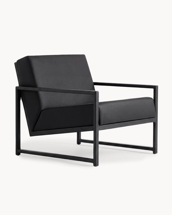 Armchair Einar in jade black vegan leather on a solid black oak frame, three-quarter view