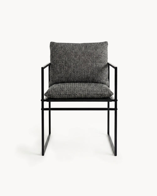 Modern chair with black frame and gray cushion on a white background