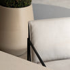 Close-up of Elsy outdoor chair in black frame with soft beige cushion, ideal for contemporary outdoor settings.