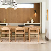 Erik dining chair in oak, featuring clean lines and timeless style in a modern dining room setting.