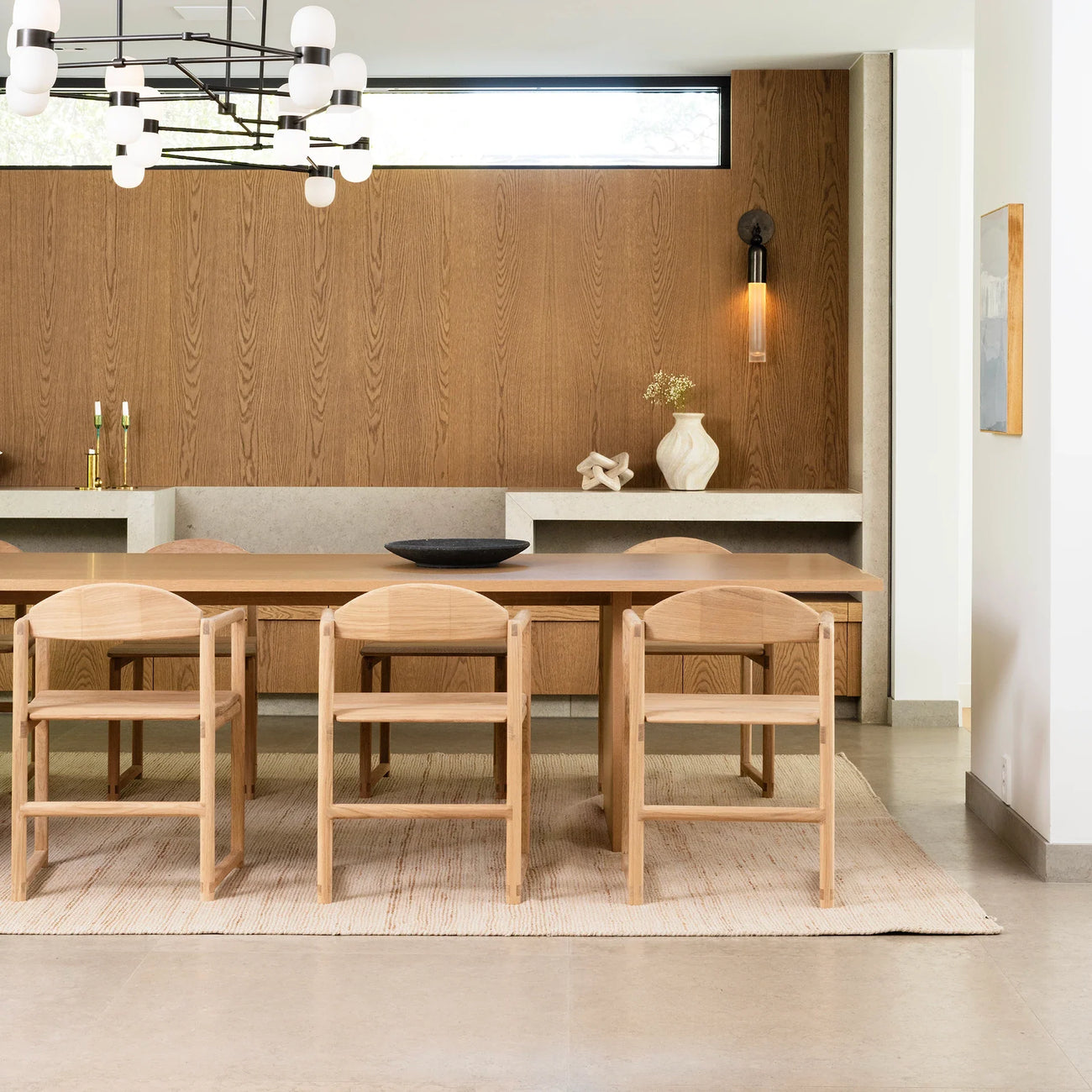 Erik dining chair in oak, featuring clean lines and timeless style in a modern dining room setting.