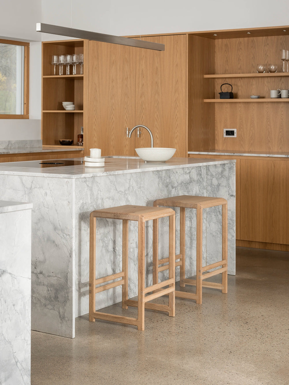 Oak Bar Stool paired with a marble kitchen island for modern dining and bar areas.