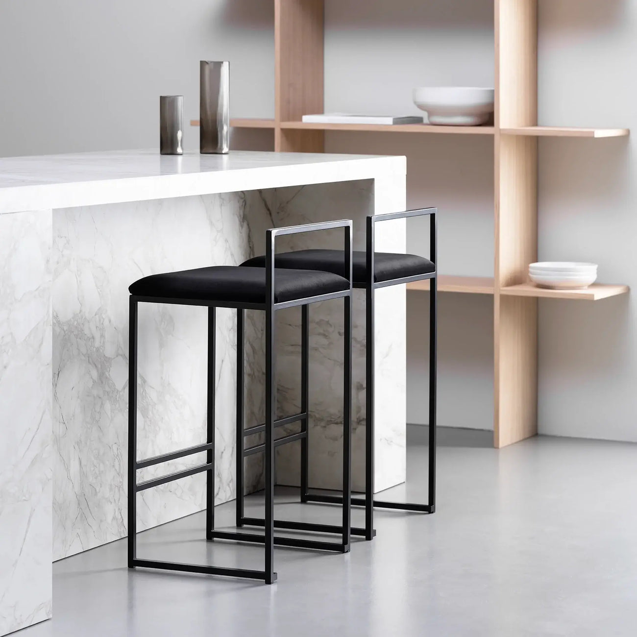 Freja bar stools in black velvet and frame, perfect for a stylish kitchen or bar setting.