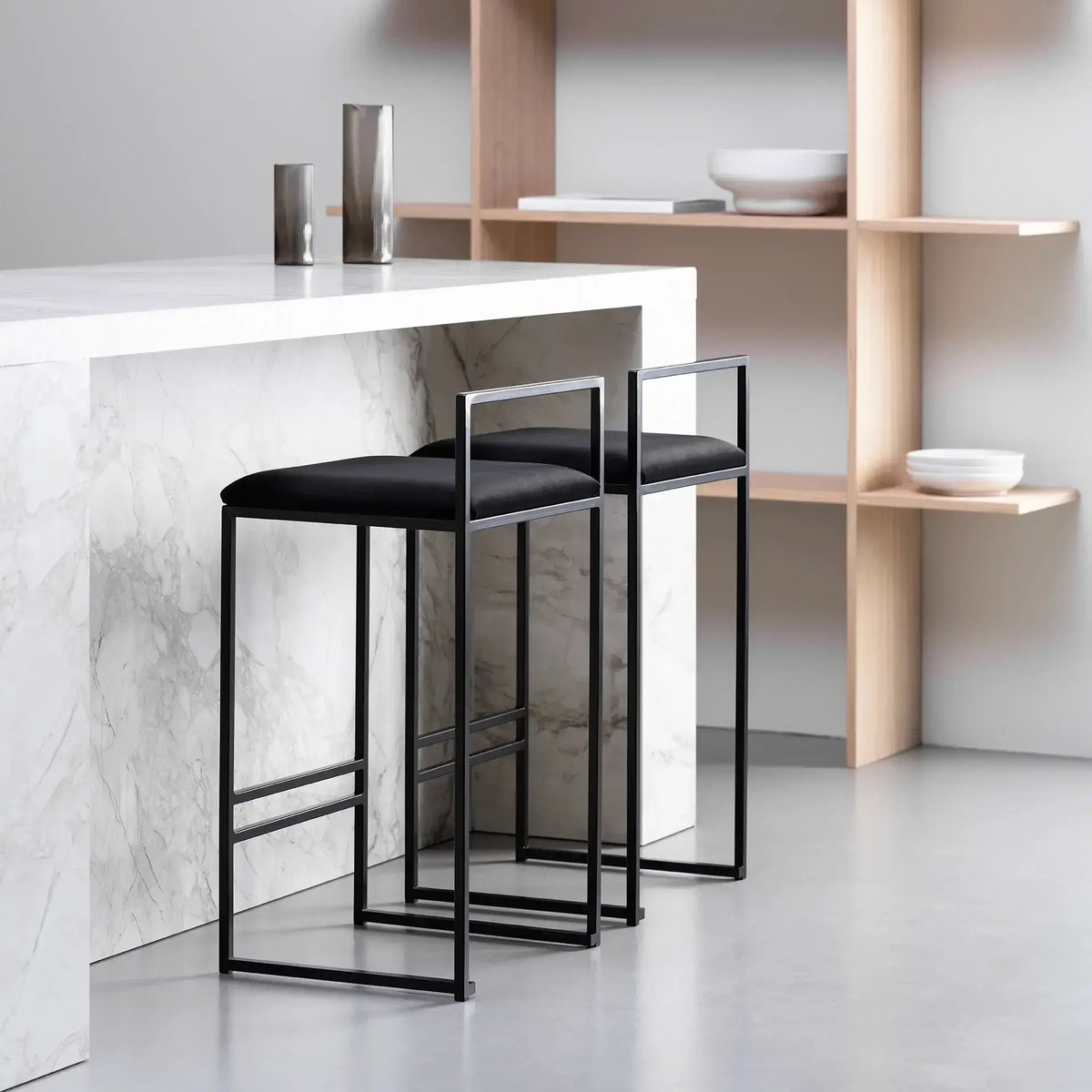 Bar Stool Freja in jade black velvet, low back and footrest, at a modern kitchen island