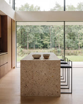 Freja bar stool by by Crea, black frame and black leather seat, Scandinavian kitchen island seating in a minimalist home.