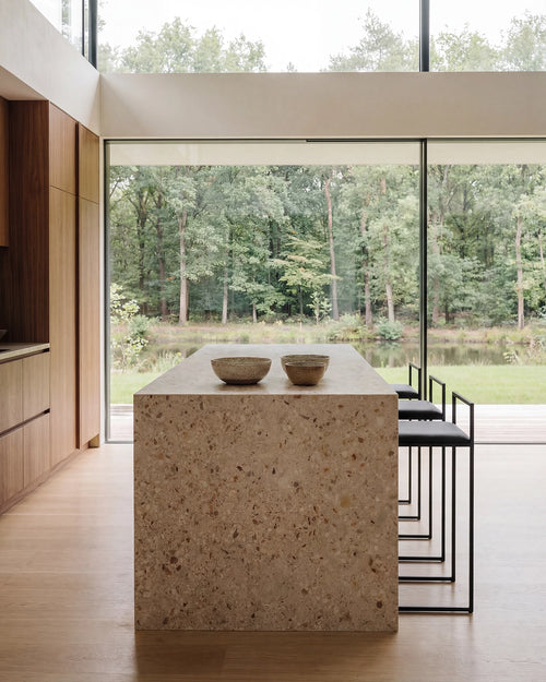 Freja bar stool by by Crea, black frame and black leather seat, Scandinavian kitchen island seating in a minimalist home.