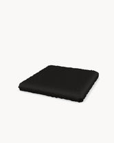 Cushion for the Freja bar stool in Black bouclé, three-quarter view