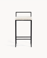 Breakfast Bar Stool Freja with black frame and ivory bouclé cushion, ideal for kitchen islands and bar counters.