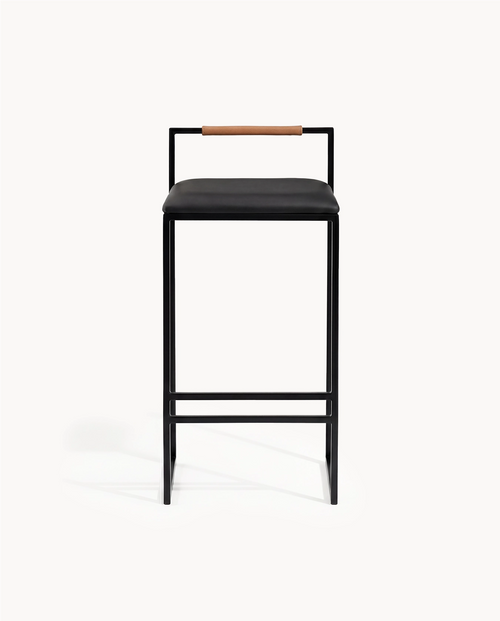 Bar Stool Freja with black frame, black leather cushion, and brown backrest for modern interior decor.
