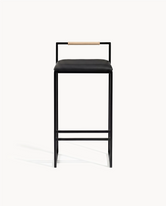 Kitchen Bar Stool Freja with black frame and leather cushion, featuring a latte backrest, perfect for modern interiors.