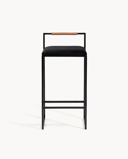 Bar Stool Freja with black frame, black velvet cushion, and coffee bean backrest for kitchen interiors.