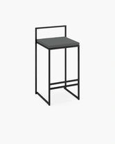 Outdoor Bar Stool Freja in black metal with onyx cushion, perfect for stylish outdoor seating.
