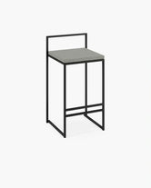 Outdoor Bar Stool Freja with black frame and fossil acrylic cushion, perfect for outdoor settings.