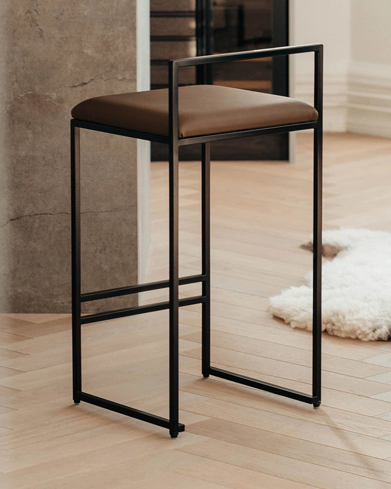 Bar Stool Freja in chocolate vegan leather on a black steel frame