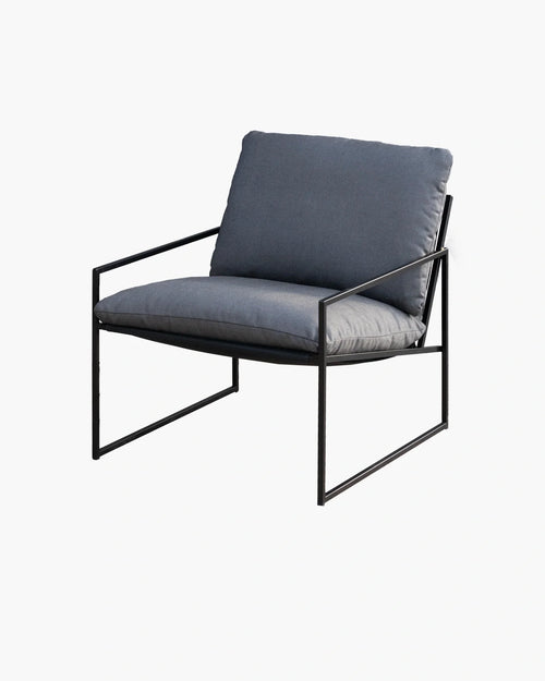 Stylish grey lounge chair with a sleek black frame, perfect for modern interior decor.