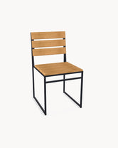 Garden Dining Chair Edith with a black powder-coated stainless steel frame and A-grade teak slats, no armrests.