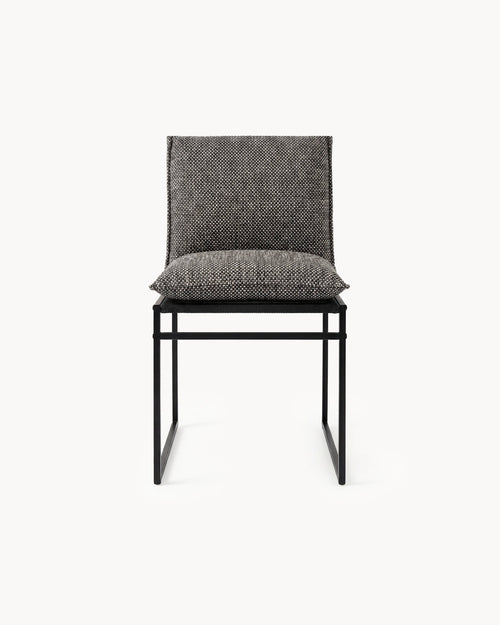 Gray upholstered chair with black frame on a white background