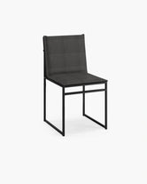 Outdoor chair Isa in black frame with onyx acrylic cushion, perfect for modern outdoor spaces.