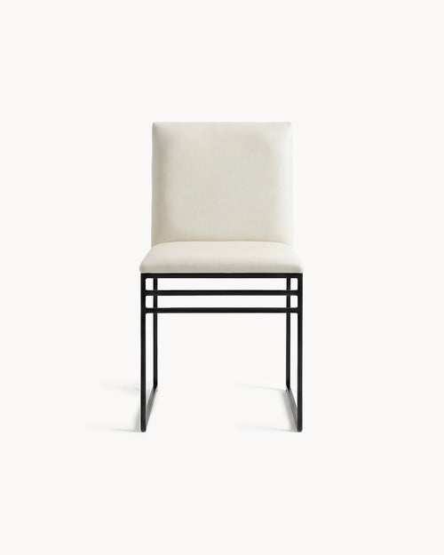 White chair with black metal frame on a white background