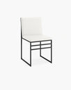 Isabell dining chair in ivory vegan leather with a sleek black metal frame, perfect for modern dining spaces.