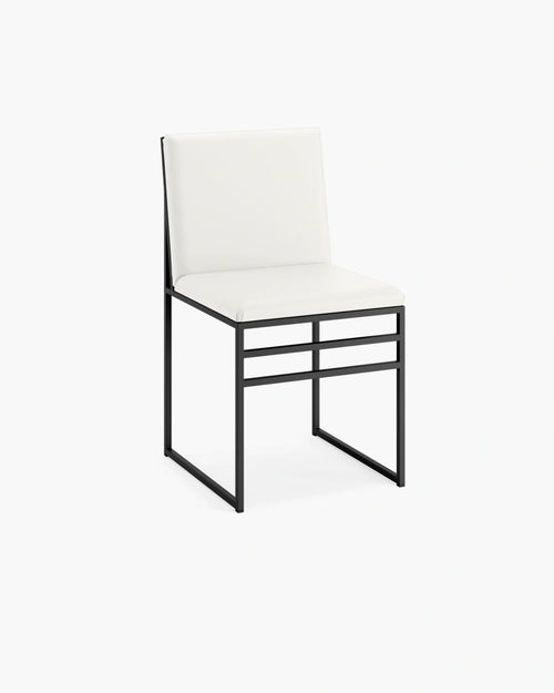 Isabell dining chair in ivory vegan leather with a sleek black metal frame, perfect for modern dining spaces.