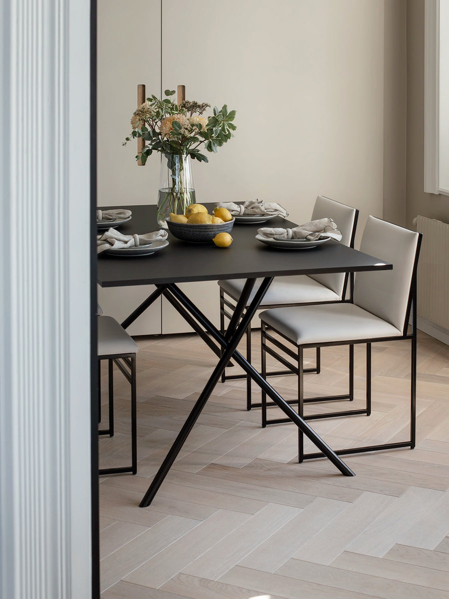 Dining table set with chairs in a modern interior setting