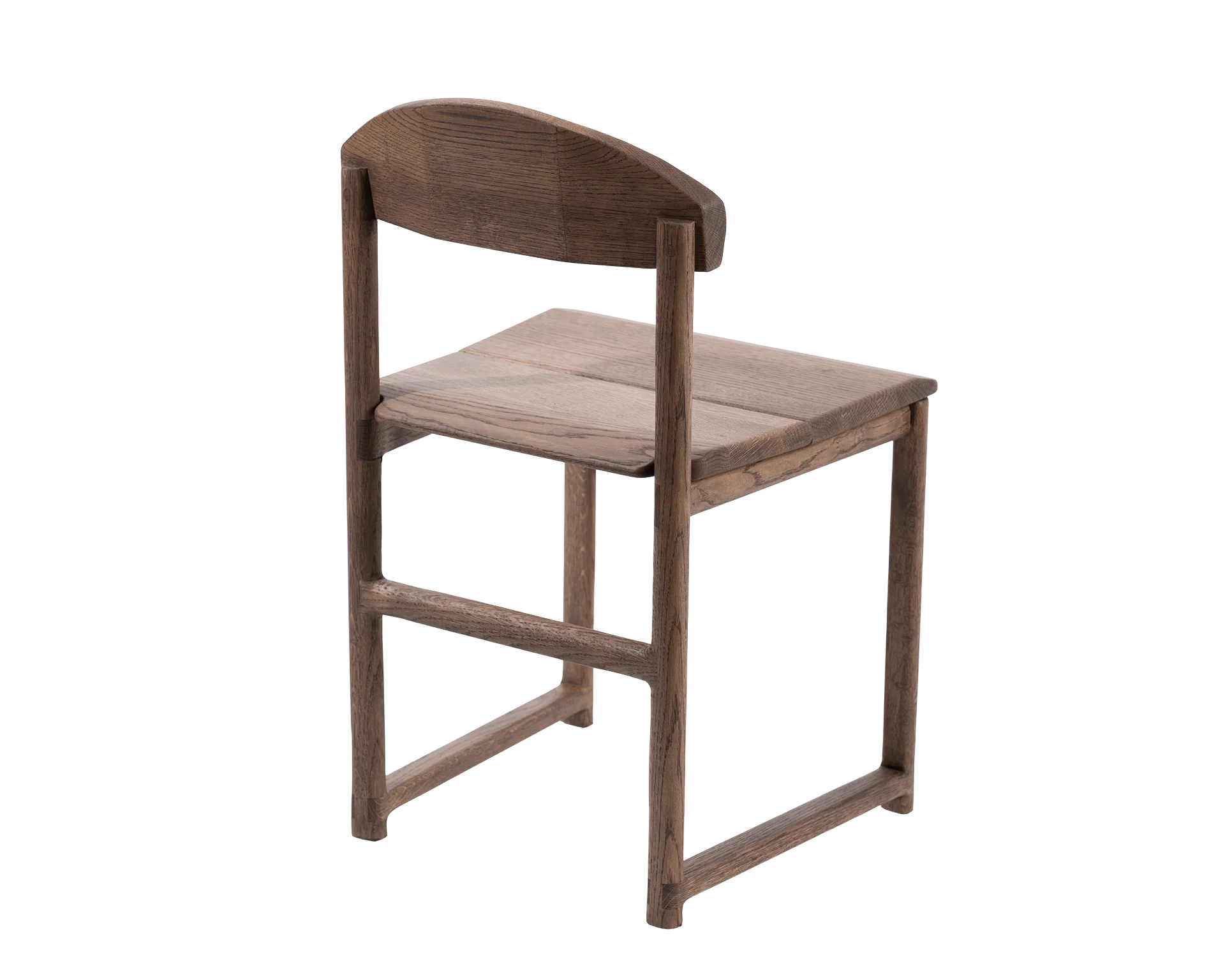 Rear view of the Karin Dining Chair in solid oak, showcasing curved backrest design and handcrafted joinery in Scandinavian style.