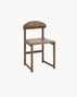 Karin dining chair in dark oak with elegant grain and soft edges, a refined classic for dining spaces.