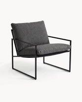 Outdoor lounge chair Kenny with black frame and onyx acrylic cushion for stylish outdoor seating.