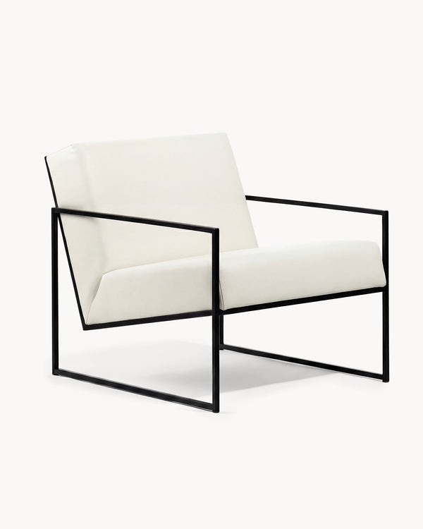 Armchair Kent in ivory vegan leather on a black powder-coated steel frame, three-quarter view