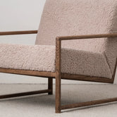 Armchair Einar in greige bouclé with dark oak frame, ideal for neutral interiors.