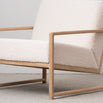 Kent oak armchair with ivory bouclé upholstery, perfect for modern Scandinavian interiors and relaxed living spaces.