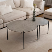 Coffee table Leo - Medium set with Black Frame and Grigio Dekton Top in a modern living room setting.
