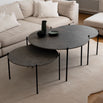 Leo Coffee Table 3-set by by Crea with Grafite Dekton tops and black steel frames, shown in a Scandinavian living room with a beige sectional and soft wool rug. Handmade modern coffee tables, perfect for contemporary interiors.