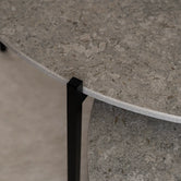 Coffee Table Leo, round Dekton Grigio stone top on a black powder-coated steel frame