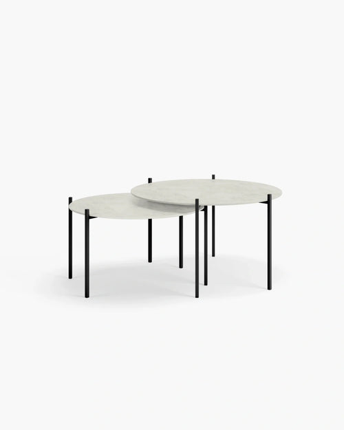 Round Leo outdoor lounge table with sleek black legs, perfect for patios and enhancing outdoor spaces.