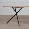 Melker dining table in black and natural oak with modern design and unique x-shaped legs.