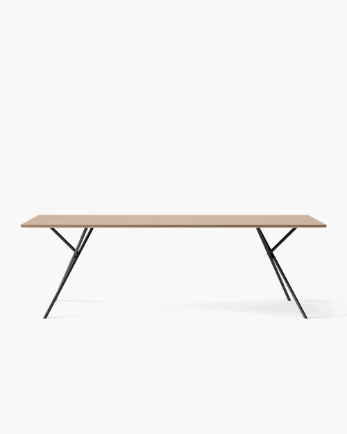 Melker dining table with a sleek wooden top and stylish black metal legs, perfect for elegant dining moments.