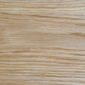 Close-up of natural solid oak with a matte lacquer finish, showing the open grain