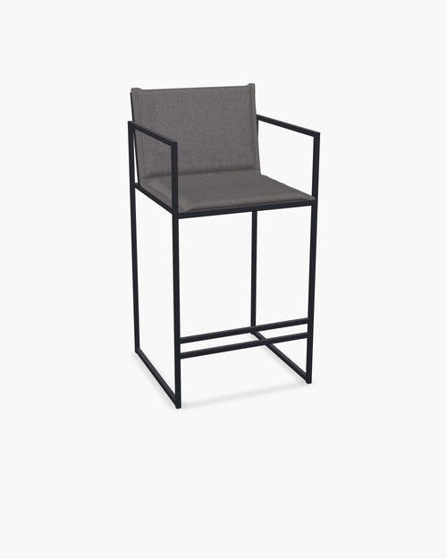 Outdoor Bar Stool Folke with black powder-coated stainless steel frame and Dusk olefin cushion.