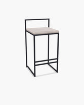 Outdoor Bar Stool Tora with black powder-coated stainless steel frame and Oat olefin cushion.