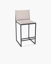 Outdoor Bar Stool Valter with black powder-coated stainless steel frame and Oat olefin cushion.