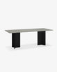 Ann outdoor dining table with a minimalist design featuring a grey top and black geometric legs, perfect for elegant outdoor settings.
