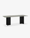 Ann outdoor dining table with a minimalist design featuring a grey top and black geometric legs, perfect for elegant outdoor settings.